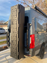 RV rental van's open modular 'ROVER' panel, recovery boards, and Thule awning offer ample gear storage for adventurers.