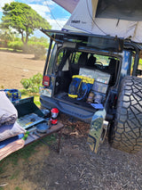Hawaii camping with an RV rental alternative: a Jeep Wrangler with rooftop tent, camp kitchen, and organized gear.