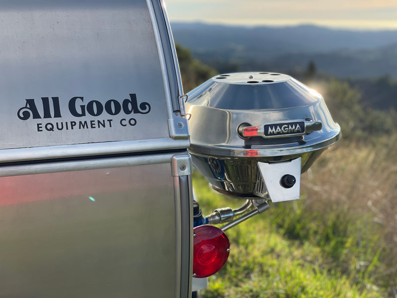 Side of an All Good Equipment Co. RV rental featuring a mounted Magma grill, ready for delicious outdoor meals in nature. — photo 14