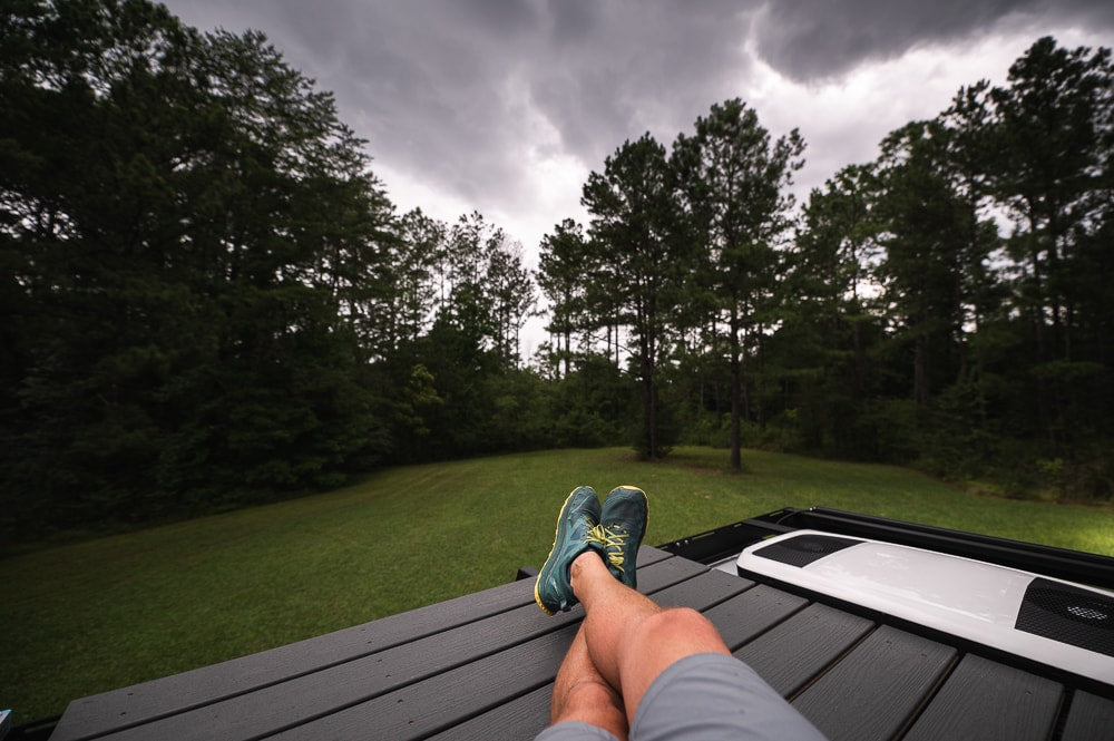  overlooking a forest under cloudy skies. Perfect outdoor retreat.|RV rental interior: two rear seats — photo 4