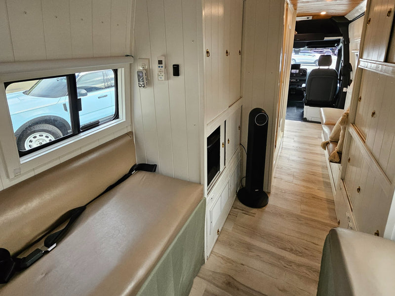  and sink with cutting board.|RV rental interior: compact kitchen with sink — photo 19