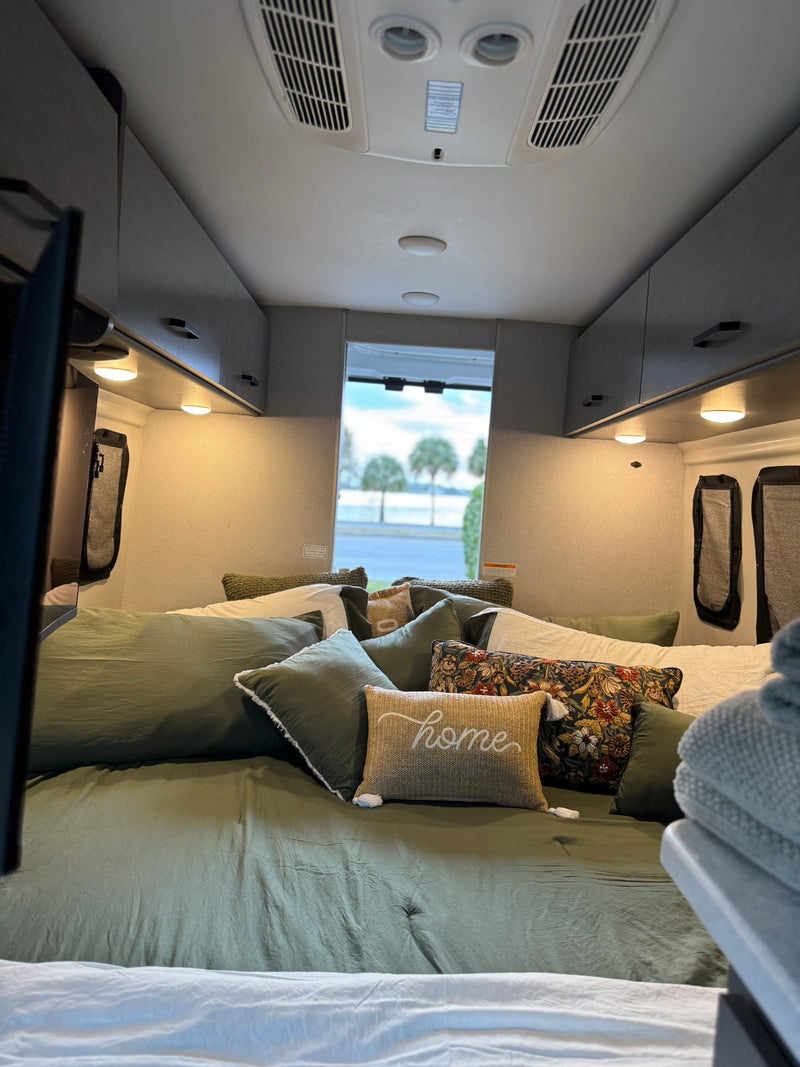  and pet bed offer outdoor comfort.|Cozy rv rental interior with decorative pillows — photo 2