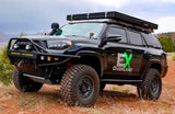 Black overlanding 4Runner with roof tent on dirt. Great adventure vehicle, consider this unique RV rental option!