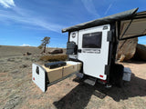TigerMoth RV rental camping trailer with pull-out kitchen, set up for outdoor adventure.