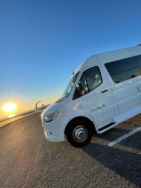 Stunning white Galleria RV rental at sunset. Enjoy road trips, exploring, and scenic views by the water!