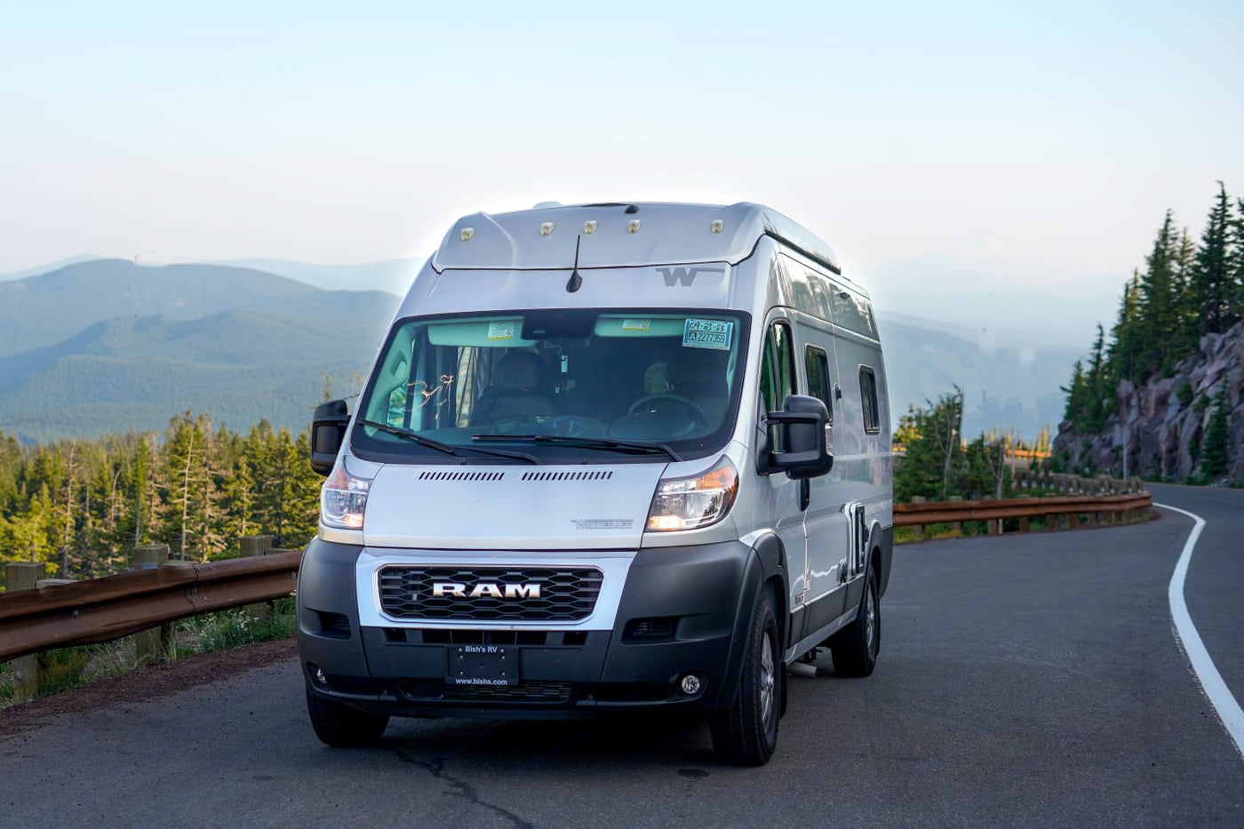  and scenic window view. Perfect mobile office for adventures.|This RV rental's cozy interior offers a comfortable bed — photo 10