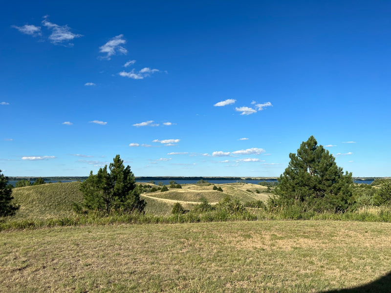 Scenic rolling hills, distant lake, and blue skies make this a perfect RV rental adventure spot for natural beauty. — photo 19
