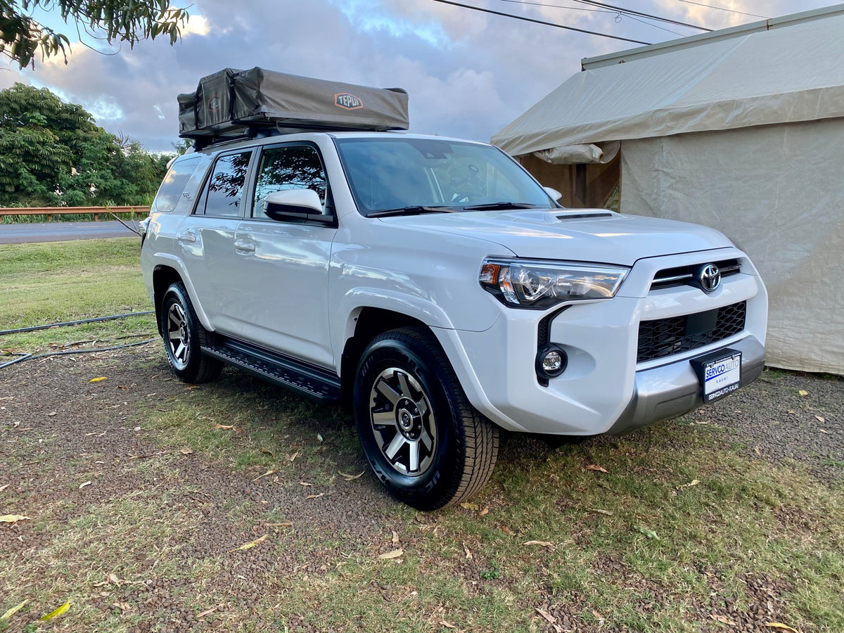 White Toyota 4Runner SUV with a Tepui rooftop tent, an ideal RV rental for off-road camping adventures. — photo 2
