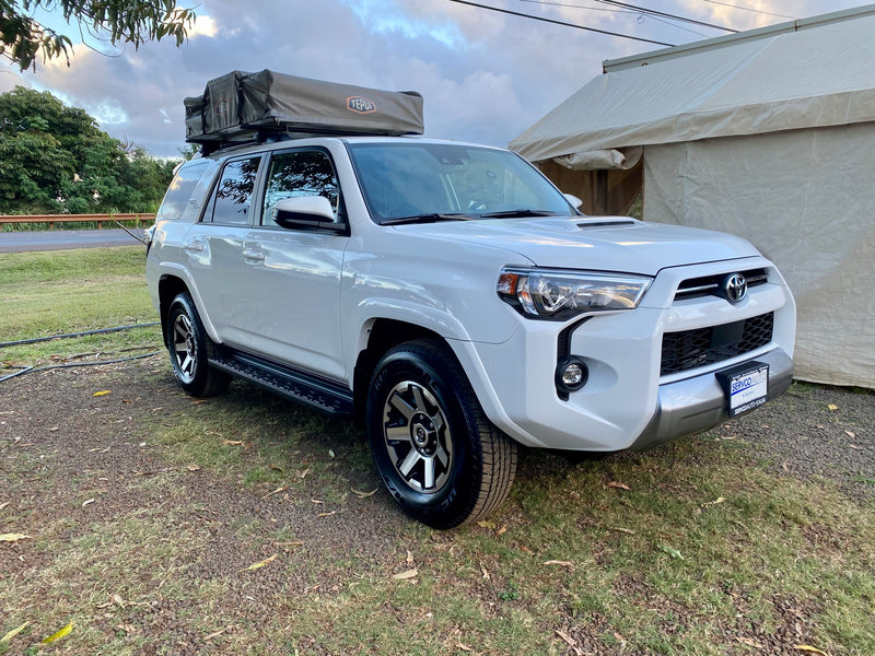 White Toyota 4Runner SUV with a Tepui rooftop tent, an ideal RV rental for off-road camping adventures. — photo 2