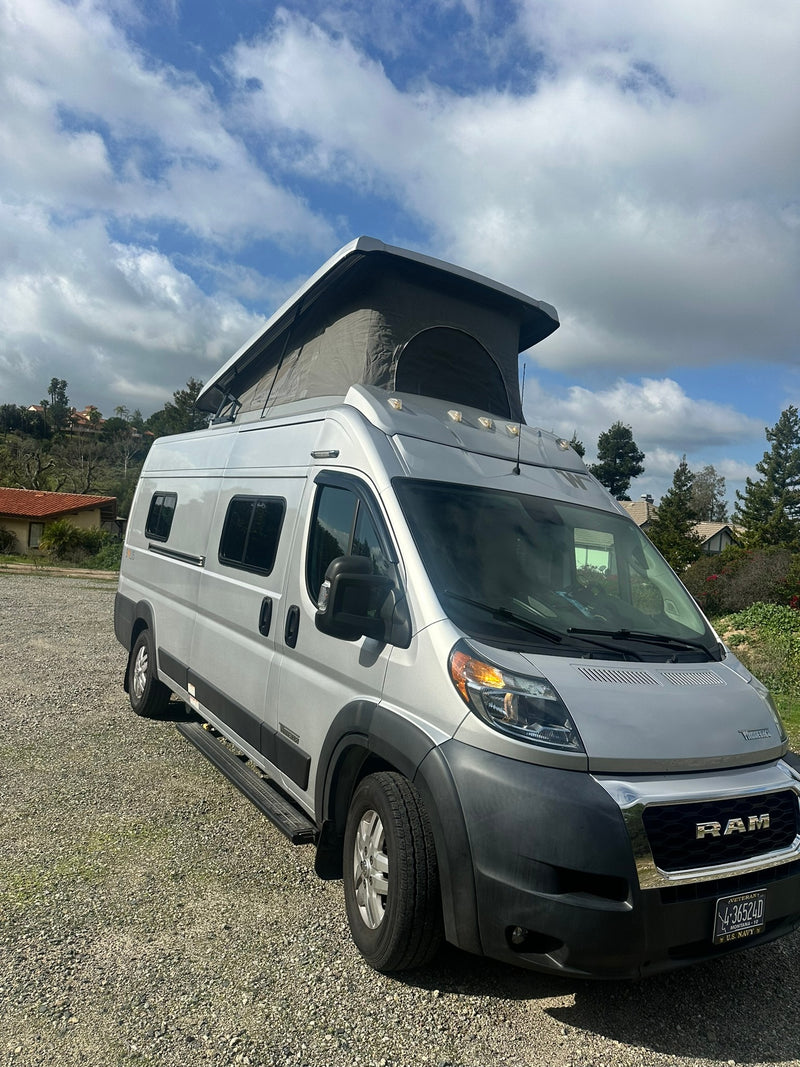 Silver Ram ProMaster camper van with pop-top extended — photo 1
