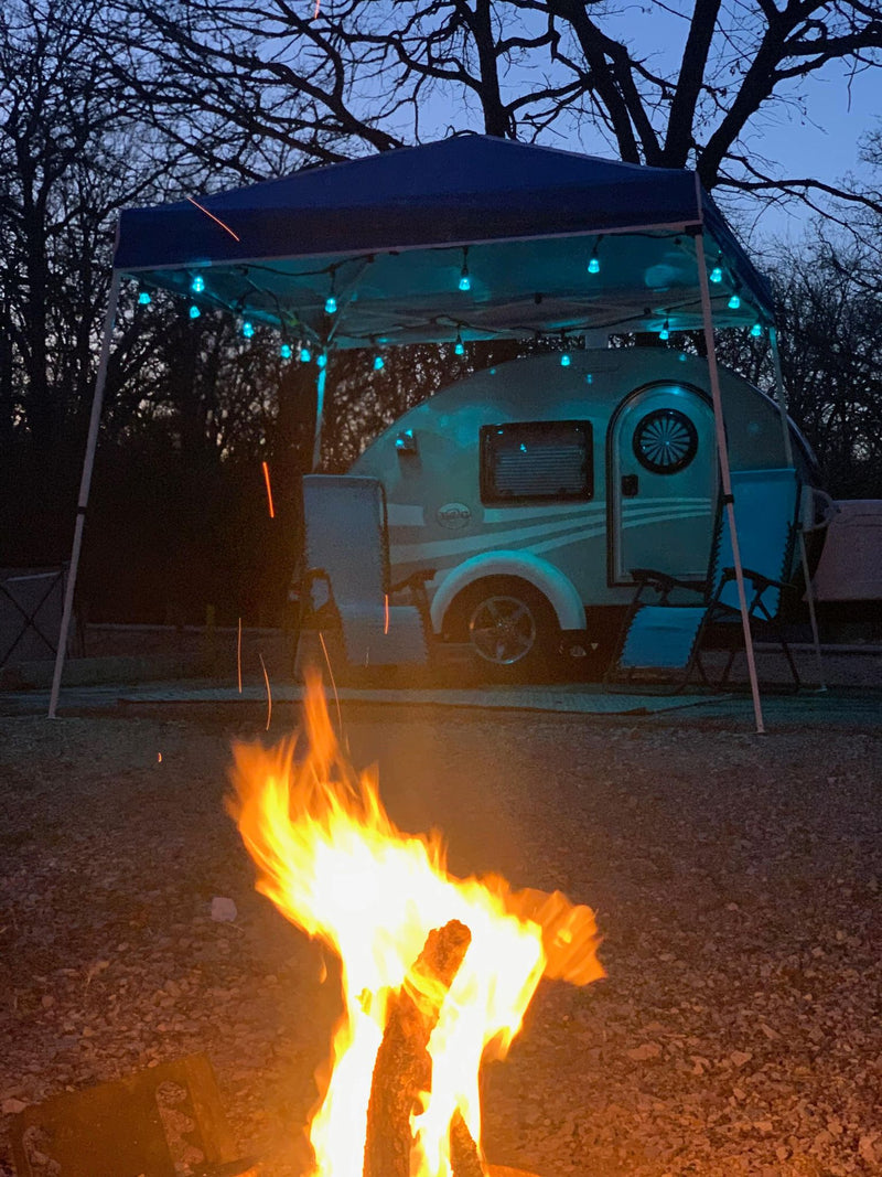  and charming teardrop trailer at dusk.|Cozy RV rental setup: a grey teardrop trailer — photo 3