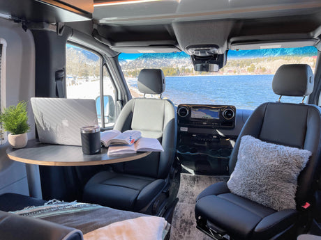 Cozy RV rental workstation with stunning lake and mountain views. Perfect for remote work on the go!