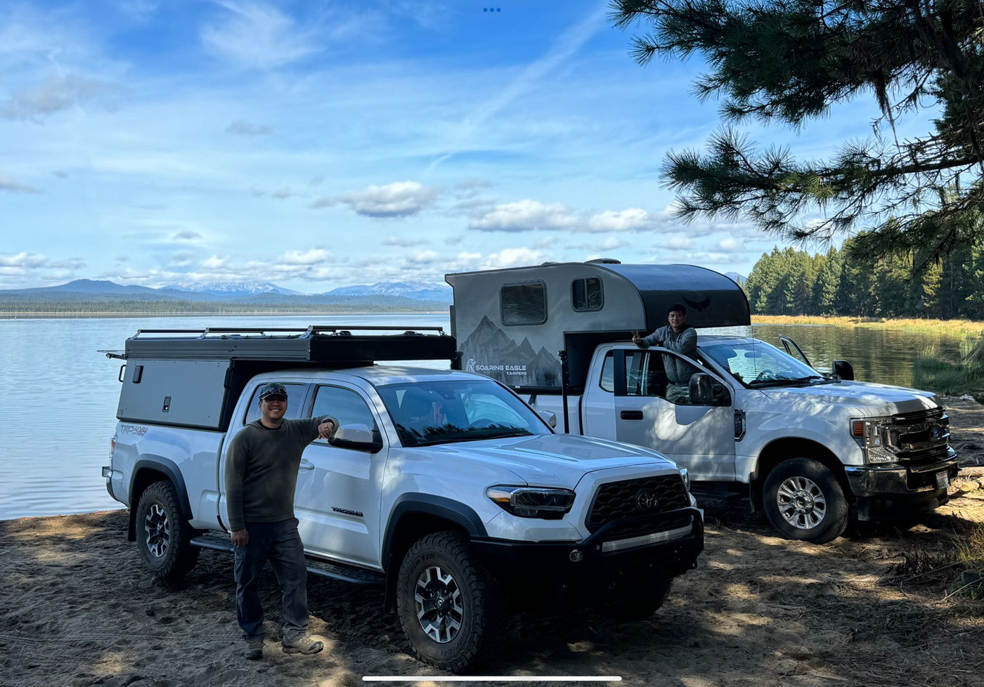  parked in lot with dog.|Lakeside truck camping: a silver Tacoma and white Ford — photo 8
