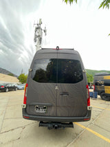 A stylish Mercedes-Benz Sprinter rv rental van, featuring a topographic map design, ideal for camping and road trips.