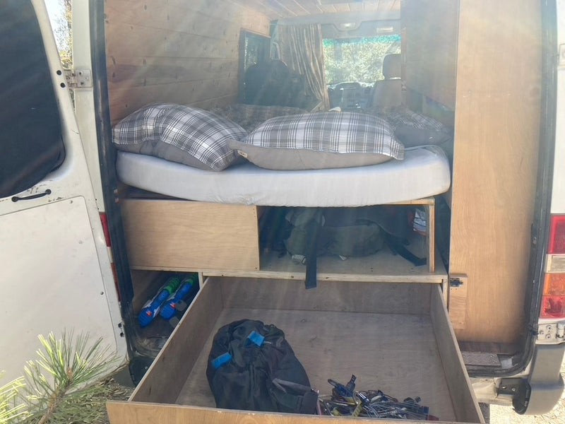  and a detailed roadrunner mural.|View inside an RV rental van — photo 19