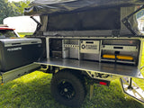 Outdoor galley kitchen with sink, Dometic fridge/freezer, and RedVision control panel