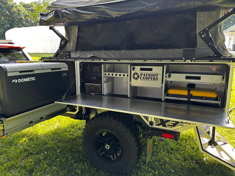Outdoor galley kitchen with sink, Dometic fridge/freezer, and RedVision control panel