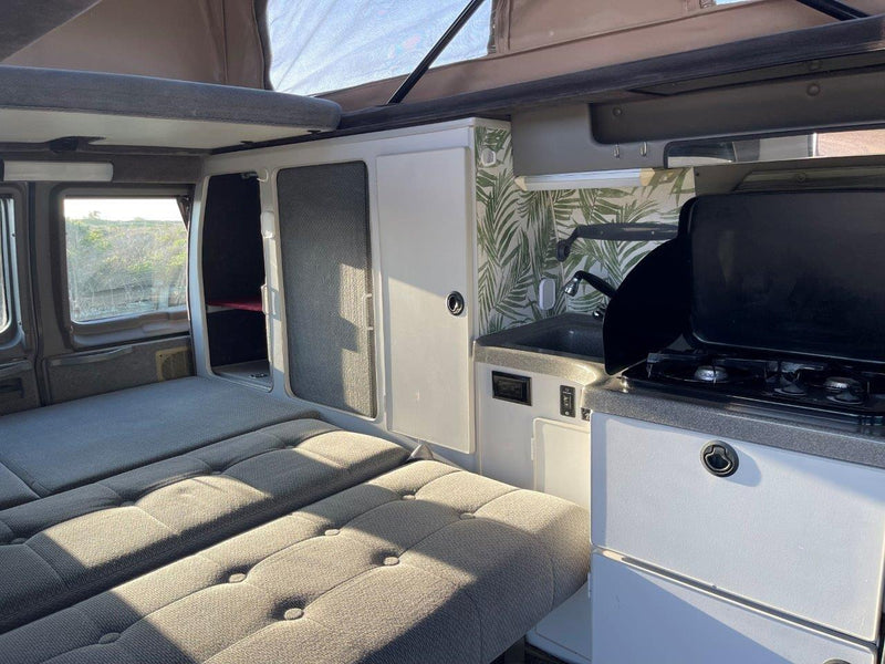  and pop-top ceiling. Ready for adventure.|RV rental kitchen with a two-burner stove — photo 10