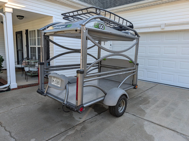  shown with tent setup & roof rack.|A grey SylvanSport Go pop-up camper trailer — photo 5