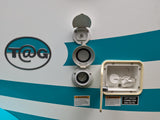 An rv rental's exterior panel displays power, water, and cable hookups with important safety warnings.