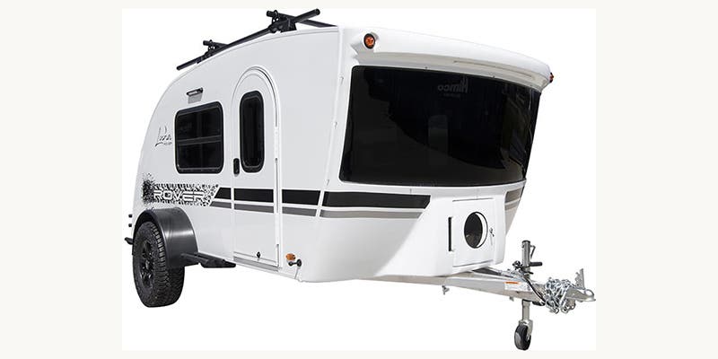  and scenic outdoor views.|Enjoy this tranquil RV rental view from inside: a window frames a sunny beach leading to a calm lake — photo 20