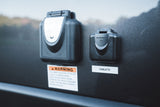 RV rental exterior panel: Furrion 20A electrical and cable TV hookups, with safety warning label below.