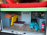 Inside this RV rental, discover smart storage under an elevated bed, a complete electrical system, and safety equipment.