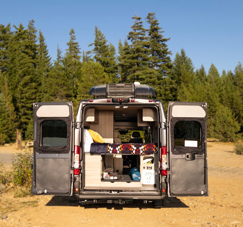  perfect for your next RV rental adventure.|Compact RV rental camper van interior: bed — photo 13