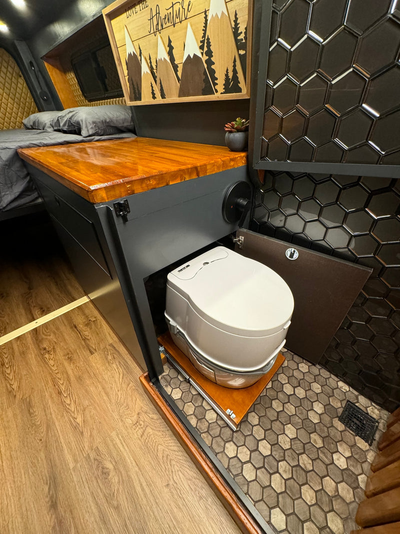  and warm ambiance for adventures.|Inside a premium RV rental: a custom van conversion with raised bed — photo 15