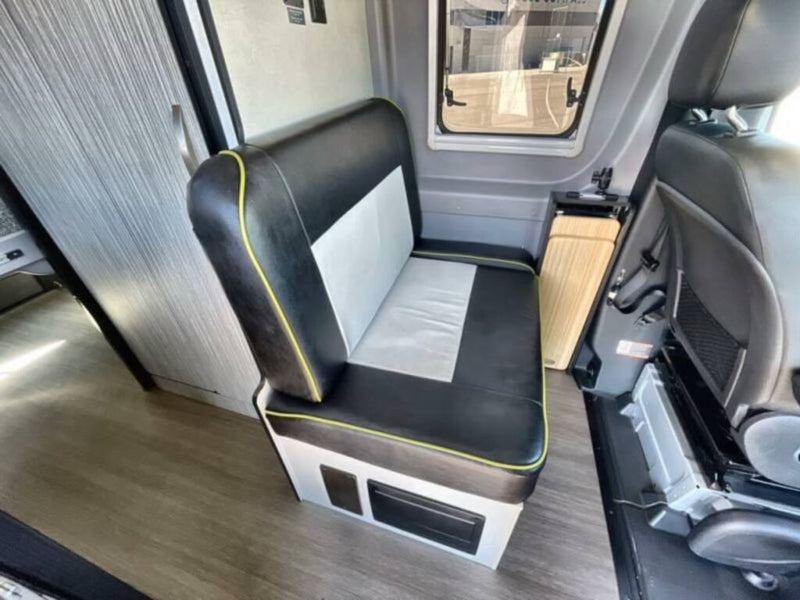  and a cozy bench bed. Perfect for travel.|Compact RV rental bathroom features wooden slatted shelves — photo 9