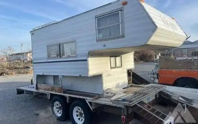 Cab over camper on flat bed trailer — photo 3