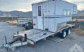 Cab over camper on flat bed trailer