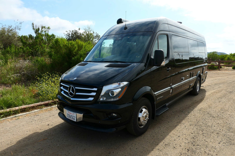  and a top-mounted AC unit.|This RV rental features a practical kitchen with a two-burner stove and a pot — photo 7