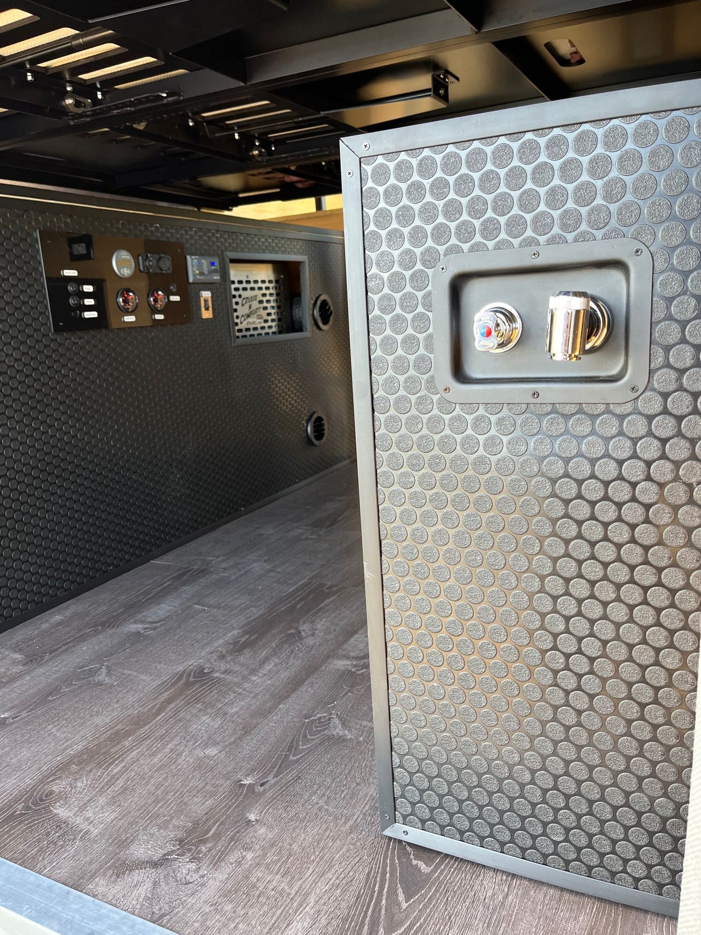 RV rental interior: control panel, water faucet, and modular design for comfortable mobile living on your road trip. — photo 8