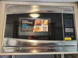 A new CONTOURE microwave oven, a key kitchen appliance in an RV rental. Remember to remove the protective film.