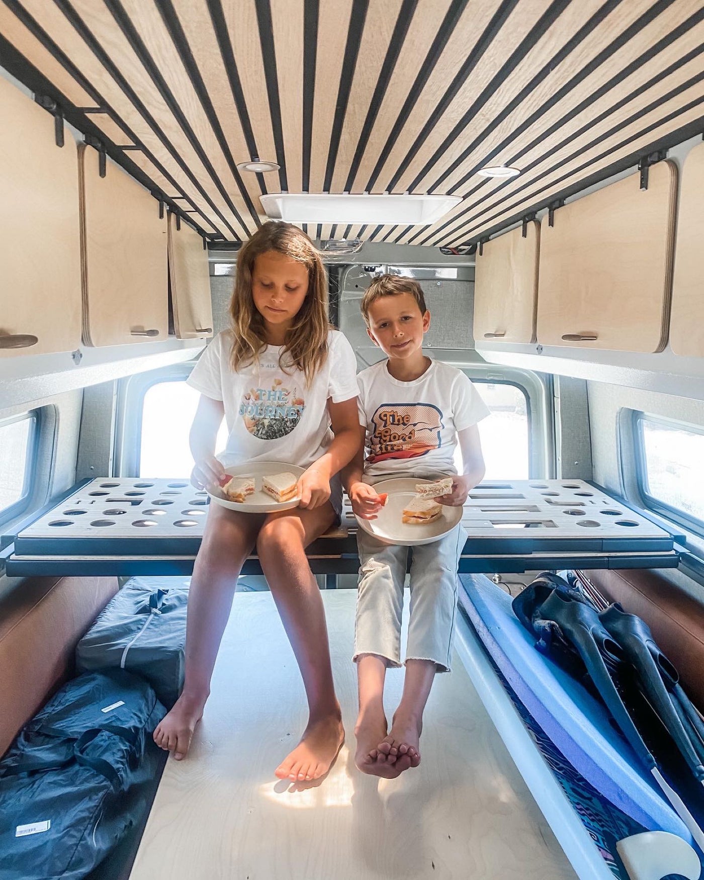  and spacious front area.|RV rental interior: practical under-bench storage with Kilmat insulation — photo 7