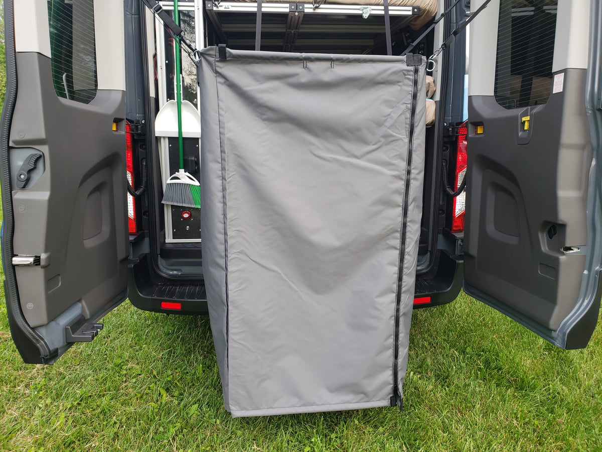  and open rear doors.|Inside an RV rental: a flexible space with a fold-down upper bunk — photo 17