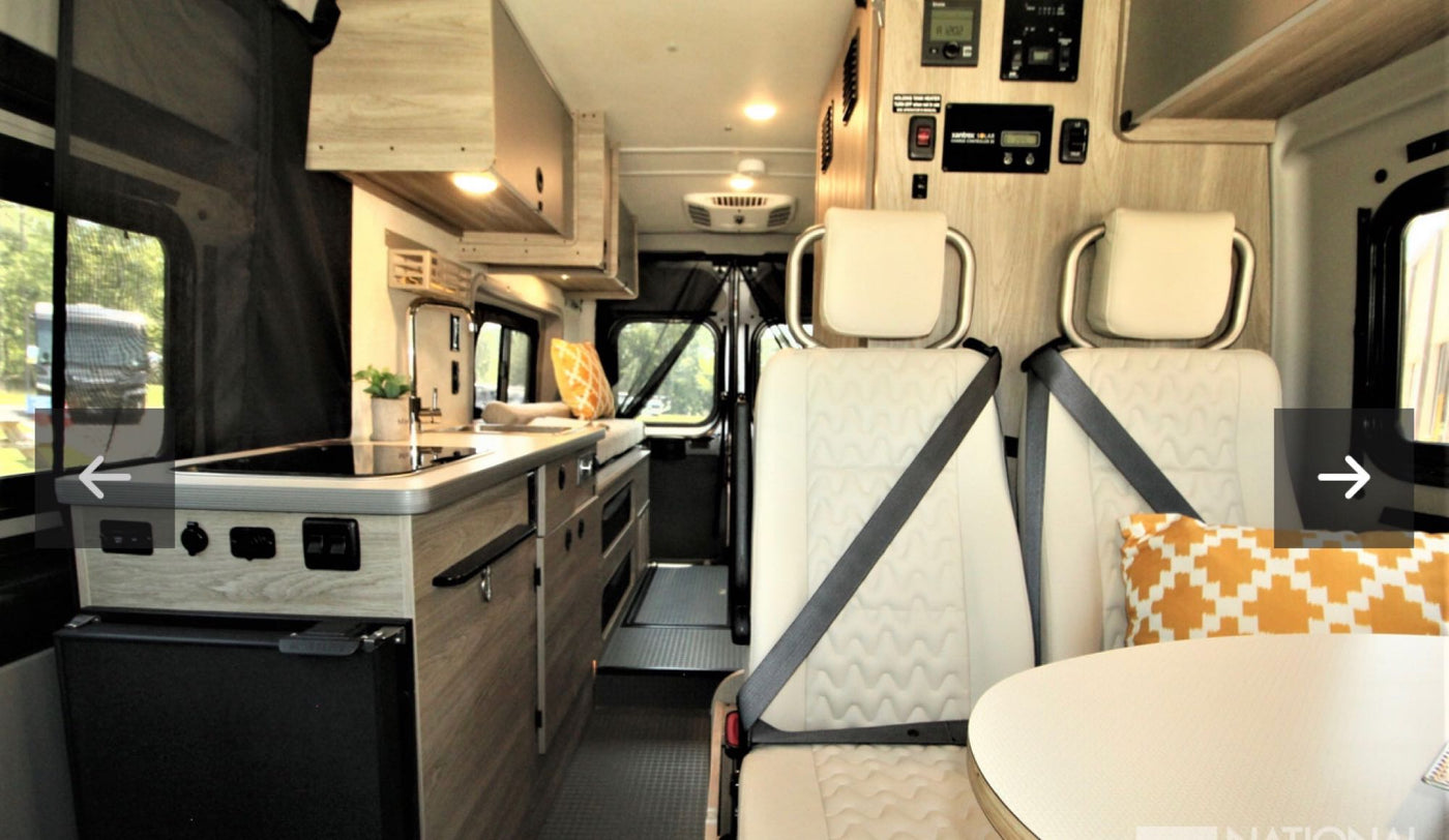  and control panels.|Inside this modern **rv rental**: light wood cabinetry — photo 6