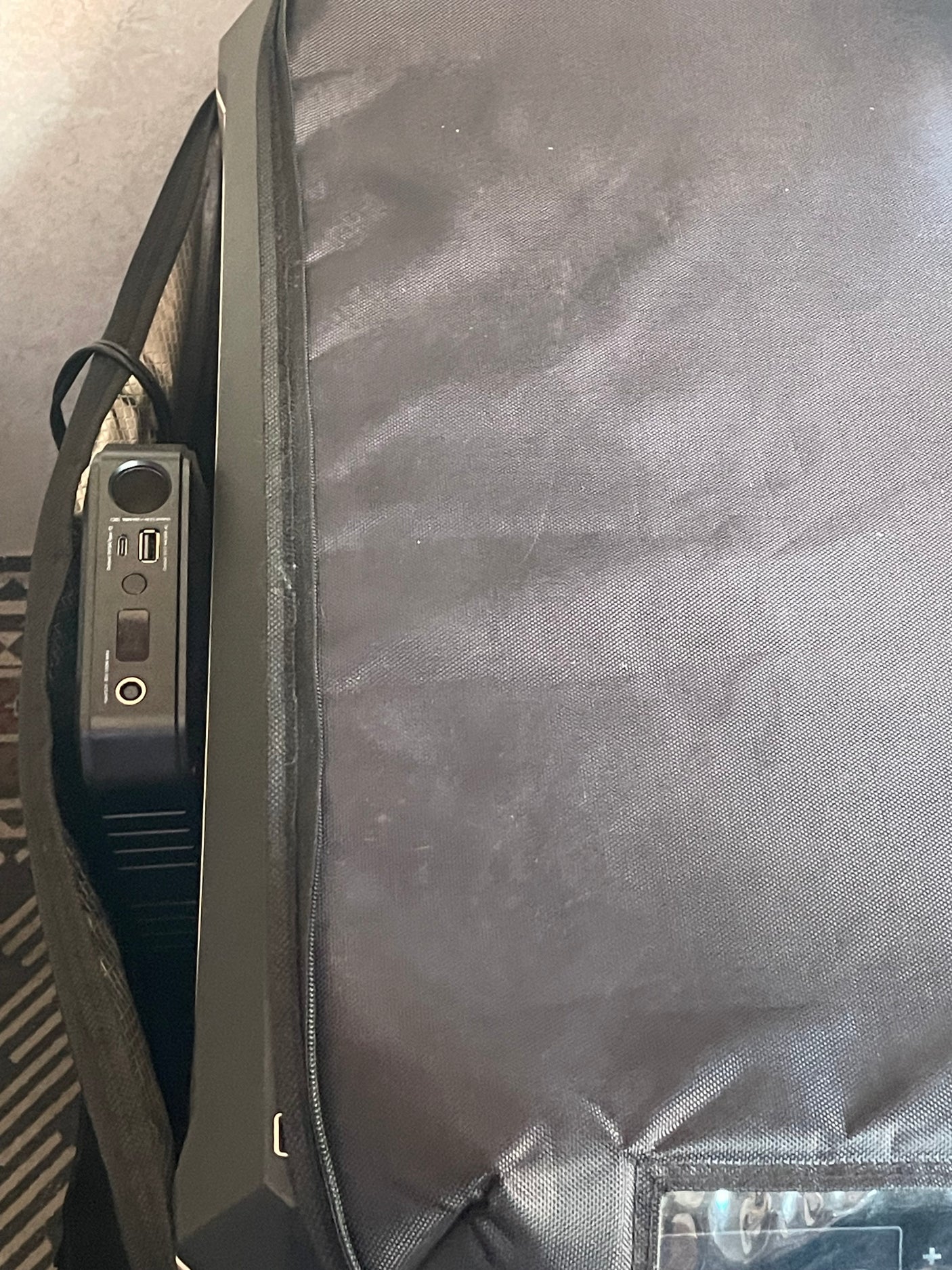Compact portable power station for an RV rental, tucked neatly in its case, ready to charge devices on your trip.
