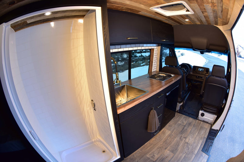  and rear storage.|Explore this RV rental's smart interior: a well-equipped kitchen — photo 10