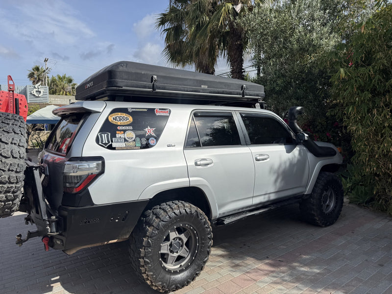 4Runner rear three-quarter with rooftop tent, spare tire and light bars — photo 4