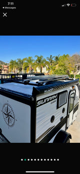 White Sunray Classic travel trailer, ideal for rv rental and outdoor adventure. Awning, roof rack & solar included.