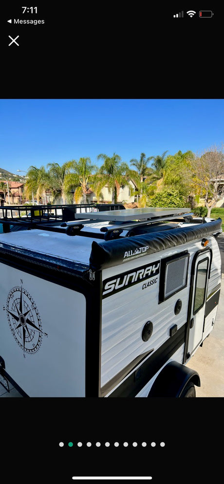 White Sunray Classic travel trailer, ideal for rv rental and outdoor adventure. Awning, roof rack & solar included.
