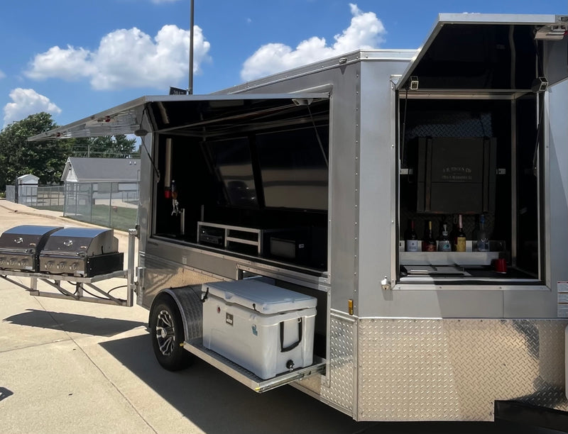 Unique mobile event trailer with grills, TVs, and a bar, available for luxury rv rental experiences. — photo 5