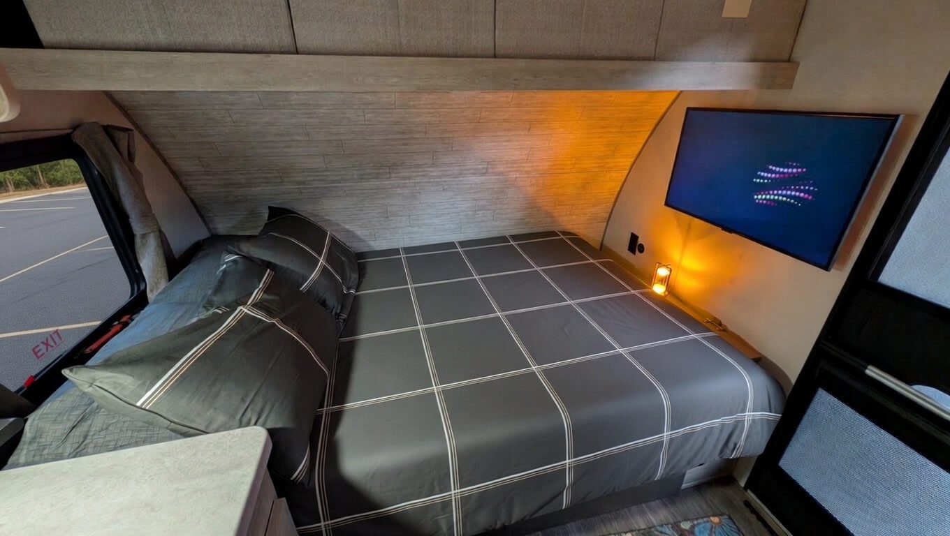  ready for your next adventure.|Modern RV rental interior featuring a kitchen with a green tile backsplash — photo 2