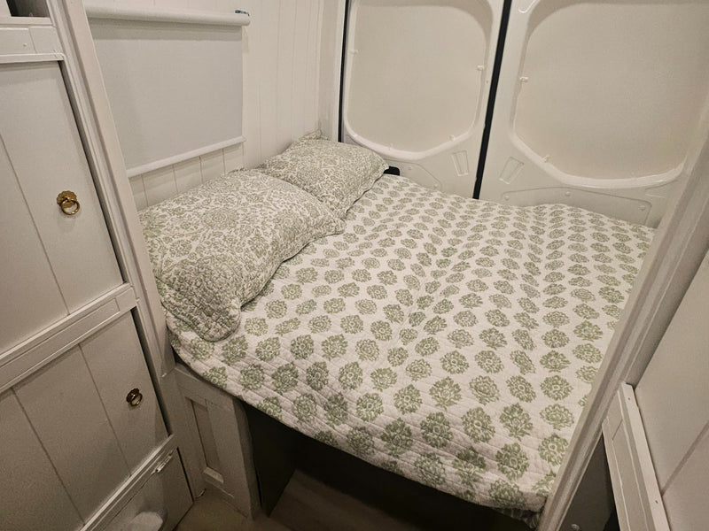  and light-colored flooring.|RV rental van interior showing a full kitchenette (microwave — photo 5