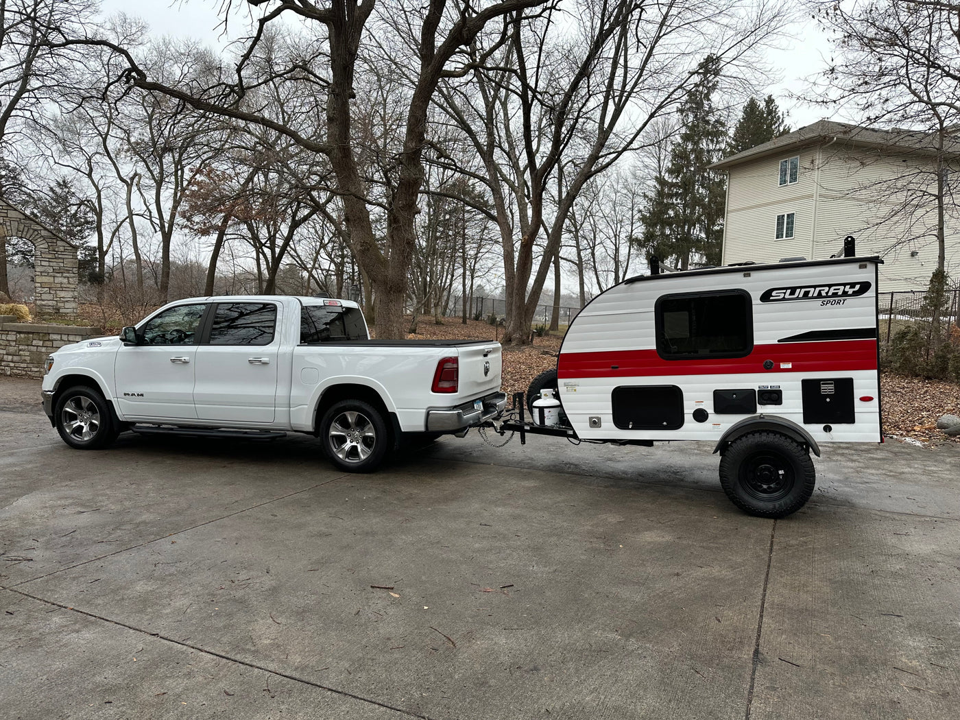 White RAM pickup towing a SunRay Sport teardrop camper, perfect for an RV rental adventure! — photo 15