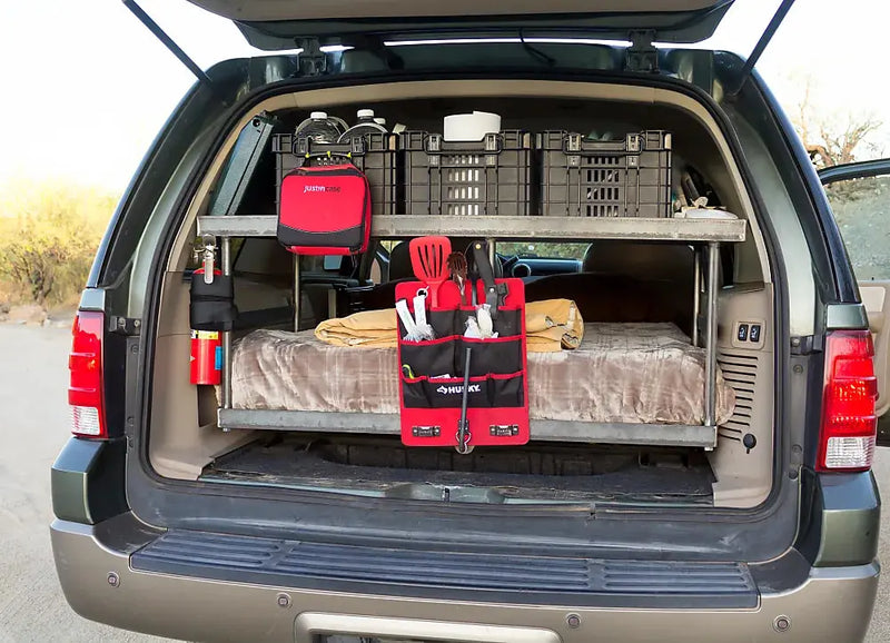 RV rental interior: A car transformed into a comfortable sleeping space with a bed — photo 20