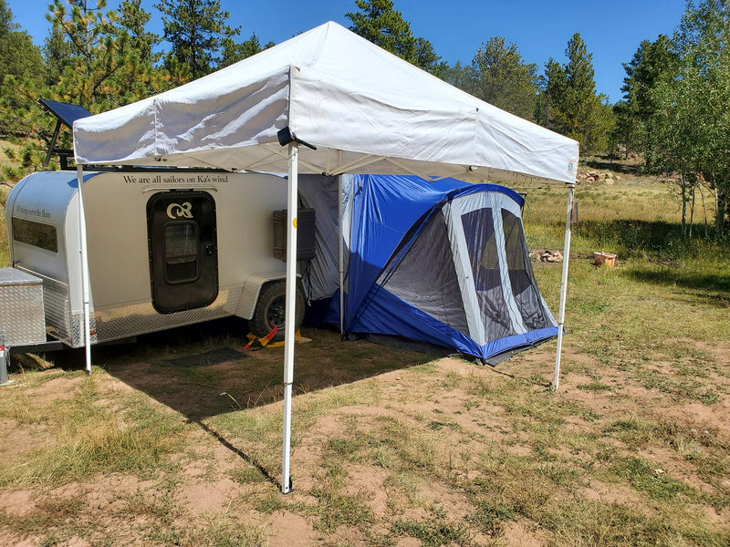  hitched to an SUV.|A silver teardrop camper — photo 6