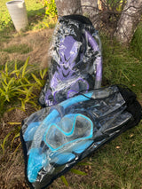 Purple and blue snorkeling gear, including masks, snorkels, and fins, packed for travel. Great for an RV rental vacation!